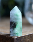 Rainbow fluorite tower with calcite snowflakes 9