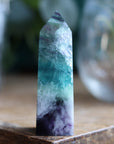 Rainbow fluorite tower with calcite snowflakes 12