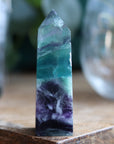 Rainbow fluorite tower with calcite snowflakes 12