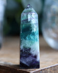 Rainbow fluorite tower with calcite snowflakes 12