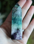 Rainbow fluorite tower with calcite snowflakes 12