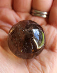 Smoky quartz sphere with rainbow inclusions 1, new