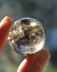 Smoky quartz sphere with rainbow inclusions 1, new