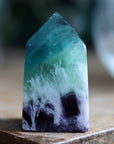 Rainbow fluorite tower with calcite snowflakes 10