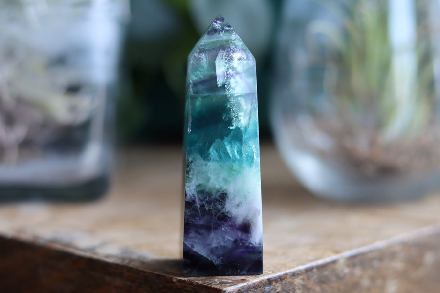 Rainbow fluorite tower with calcite snowflakes 12