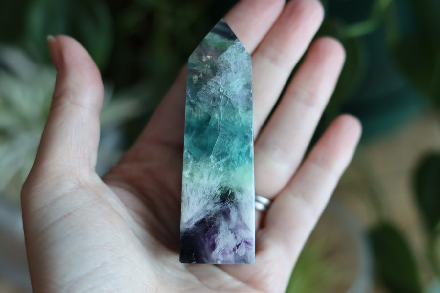 Rainbow fluorite tower with calcite snowflakes 12