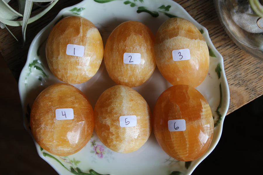 Orange calcite pocket stone