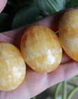 Orange calcite pocket stone