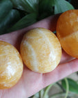 Orange calcite pocket stone