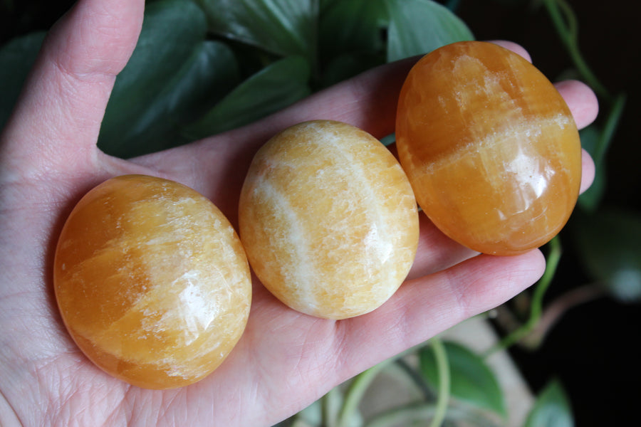 Orange calcite pocket stone